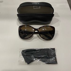 Lightly used Vogue sunglasses. Comes with dust cloth (unused) and case.